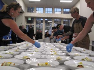 Chefs' Dinner event - chefs assembling banquette meals