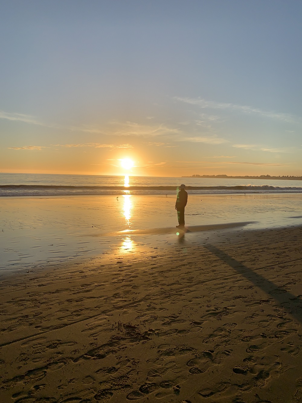 person watching sunset at the beach