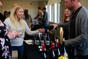 pouring wine at an event