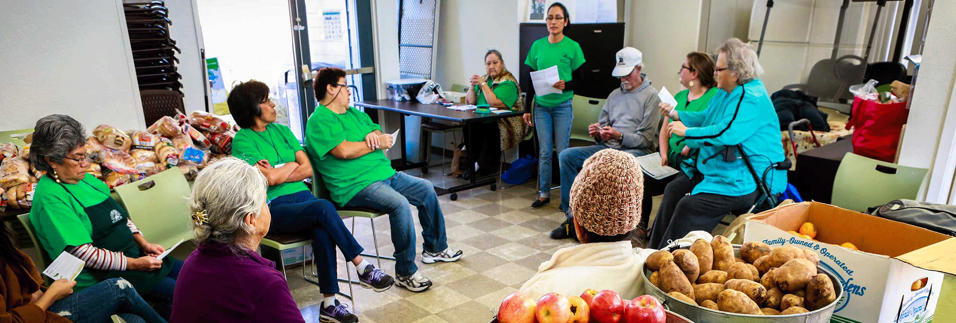 Nutrition class with buckets of fresh fruits and vegetables