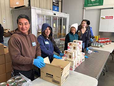 Volunteers packing boxes