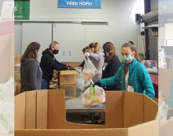 volunteers sorting and packing food