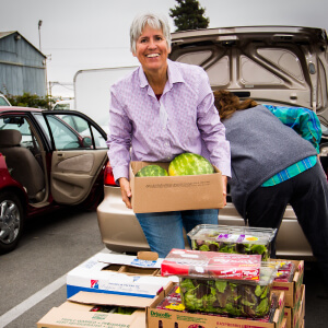 Picture of woman lifting watermelon