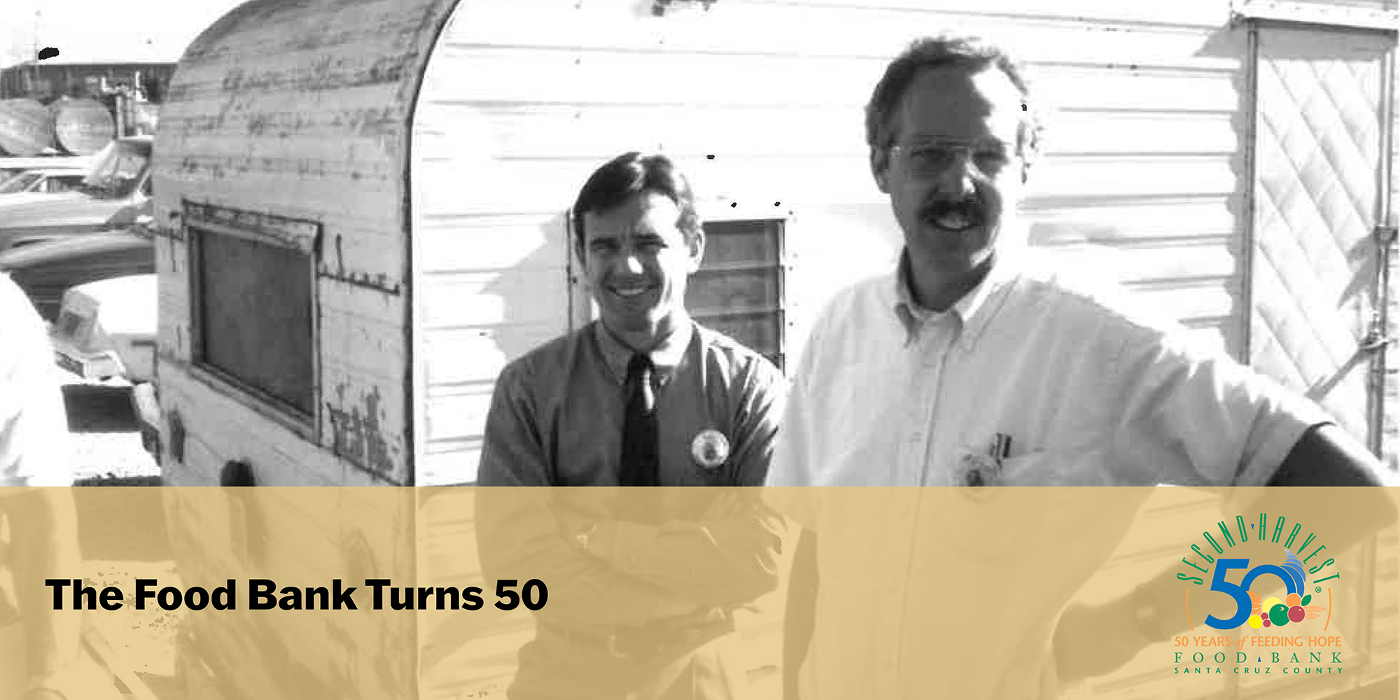 Willy and Jess in front of old volunteer trailer (black and white image)